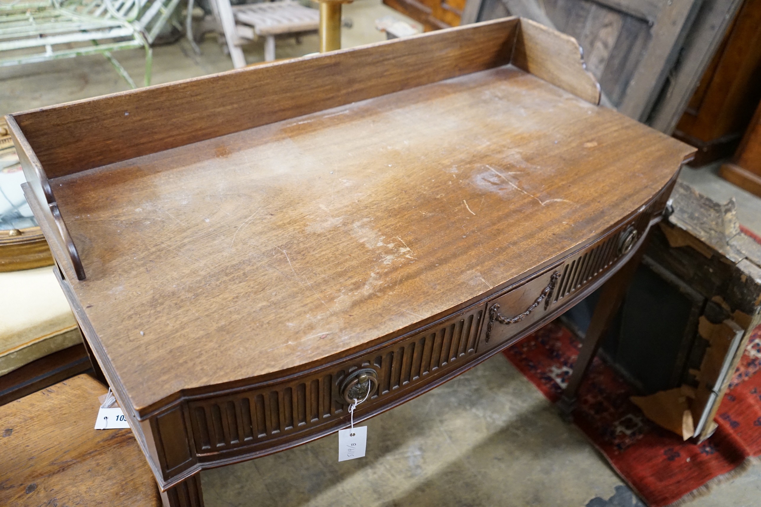 An Edwardian Chippendale revival mahogany bowfront wash stand, width 99cm, depth 50cm, height 88cm